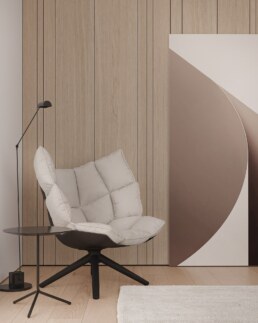 Bedroom reading chair beside a curved sculptural doorway