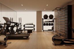 Private home gym with weight equipment and timber flooring